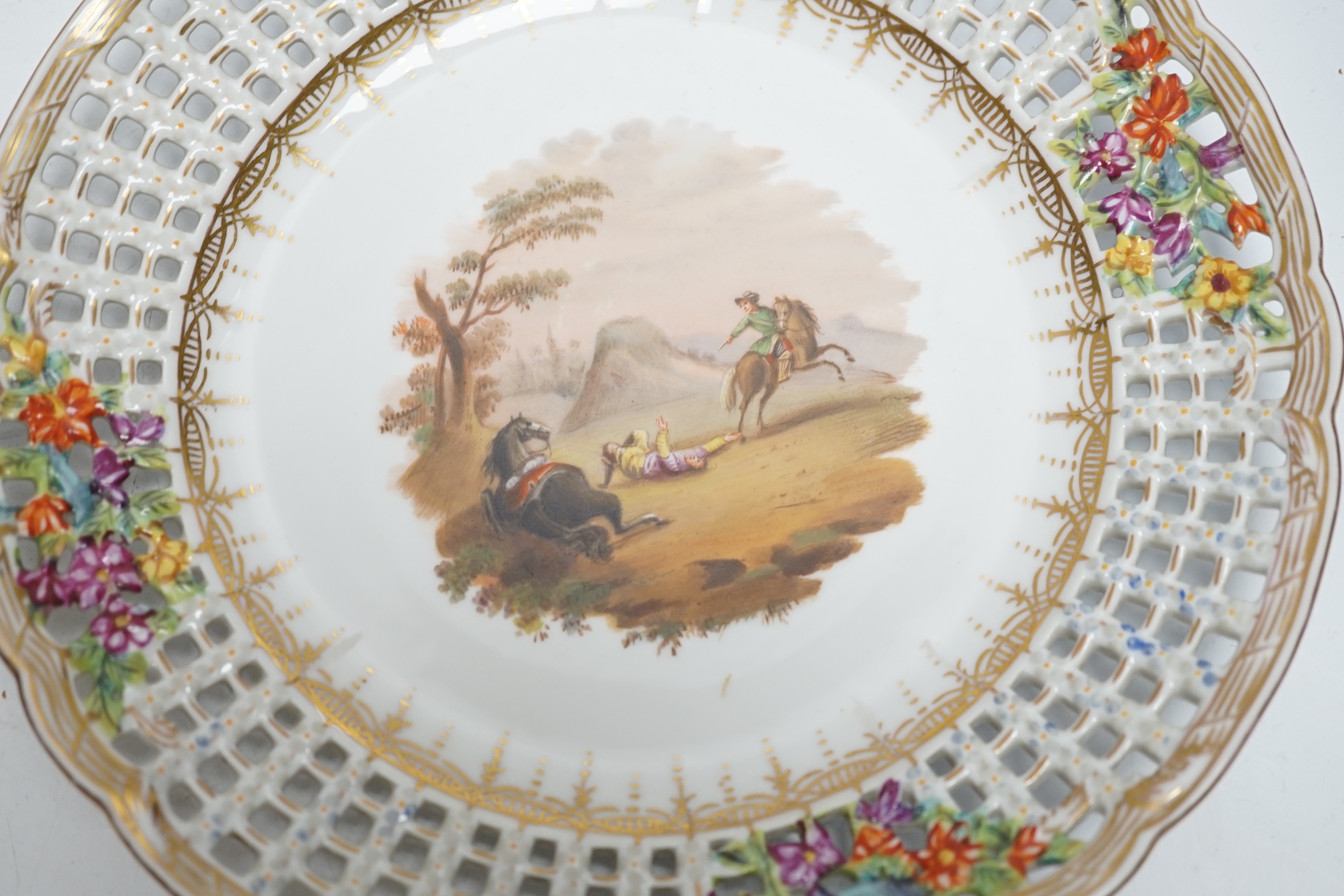 A set of four Dresden porcelain cabinet plates decorated with landscapes, 22cm diameter